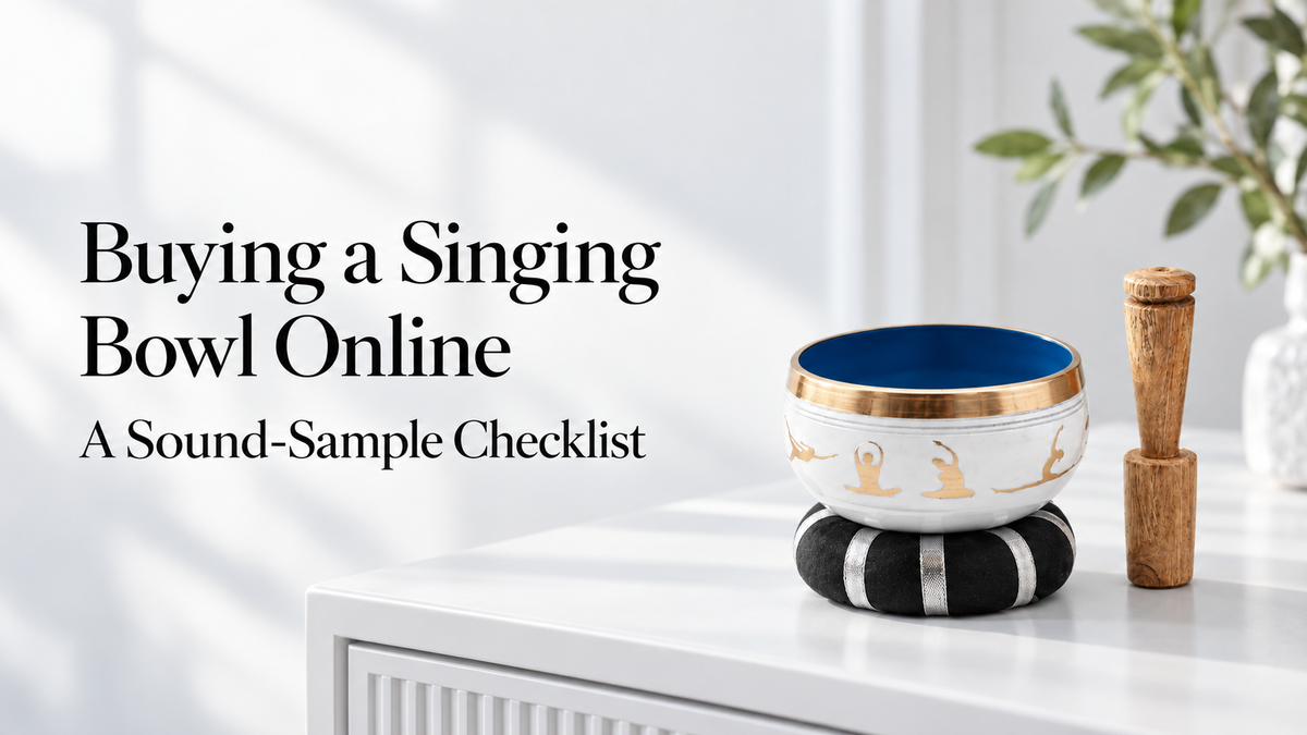 Buying a Singing Bowl Online: A Sound-Sample Checklist. White and blue Yoga Moves singing bowl, ring cushion and wooden striker on a white sideboard.