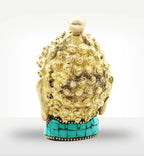Brass Buddha Figure - Med Head - 8 cm showing the intricate textured curls and a turquoise inlaid base, highlighting craftsmanship and detail in a decorative brass Buddha figure.