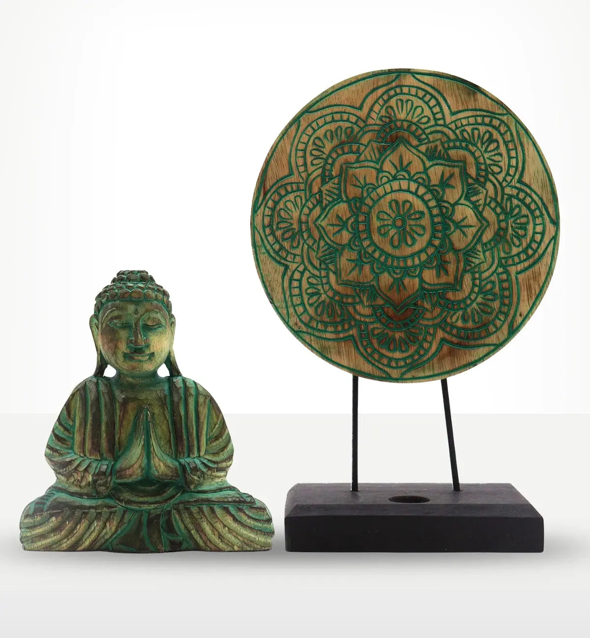 Decorative wooden Buddha statue seated in meditation next to a round, intricately carved mandala disc on a black stand, featuring green accents in the Buddha Feng Shui Set - Buddha Knot - Green.