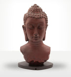 Buddha Bust Lamp Molton Lava - Oval stand featuring a serene, textured Buddha head sculpture with a rustic burnt red finish on a dark oval base, perfect for Buddha decor and glow lamps.