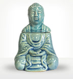 Sitting Buddha Oil Burner - Blue ceramic resin Buddha decor piece with a glossy finish, featuring a serene meditative pose ideal for home fragrance and spiritual ambiance.