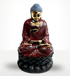 Antique Buddha - Classic Statue featuring a hand-painted figure with gold accents, deep red robes, and a blue textured hair design seated in a meditative posture.