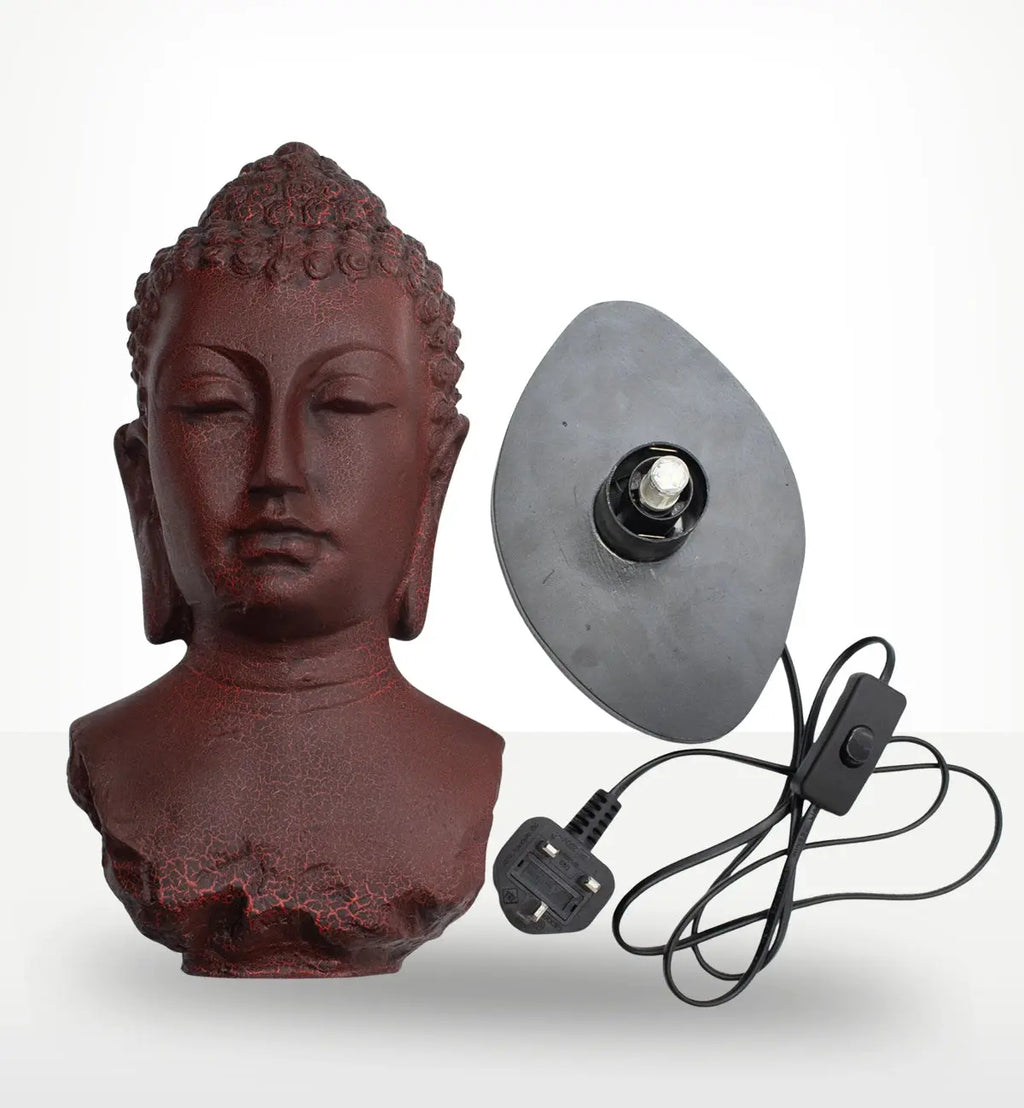 Buddha Bust Lamp Molton Lava - Oval stand featuring a deep red textured Buddha head with a modern lamp base and power cord, blending spiritual decor with functional lighting.