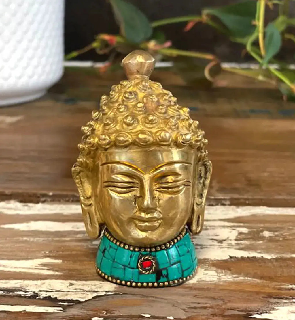 Brass Buddha Figure - Med Head - 8 cm with intricate curls and serene facial features, adorned with a turquoise base featuring a red stone accent, perfect for Buddha decor.