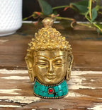 Brass Buddha Figure - Med Head - 8 cm featuring a detailed golden brass Buddha head with intricate curls and a turquoise beaded base with a red accent, perfect for Buddha decor.