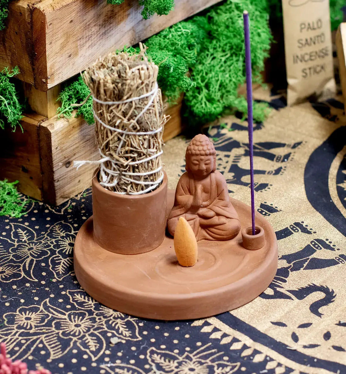 Multi Purpose Buddha Incense Plate - Natural Terracotta Style featuring a small Buddha figure, incense cone, stick holder, and bundle on a round terracotta base.