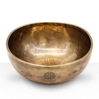 Small Nepalese Moon Bowl - (approx 550g) - 13cm made of polished brass with a traditional etched symbol on the side, perfect for meditation or decorative use.
