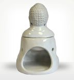 White ceramic Sitting Buddha Oil Burner - White featuring a smooth finish and hollow space for candle placement, designed as a serene Buddha figure for calming home decor.