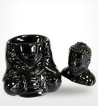Sitting Buddha Oil Burner - Black featuring a glossy black resin design with a serene Buddha figure, perfect for elegant Buddha decor and aromatic oil diffusion.