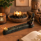 A serene Antique Buddha - Incense Burner & Box featuring a hand-painted Buddha figure seated on a detailed carved base holding a small candle, set on a wooden surface with warm ambient lighting.