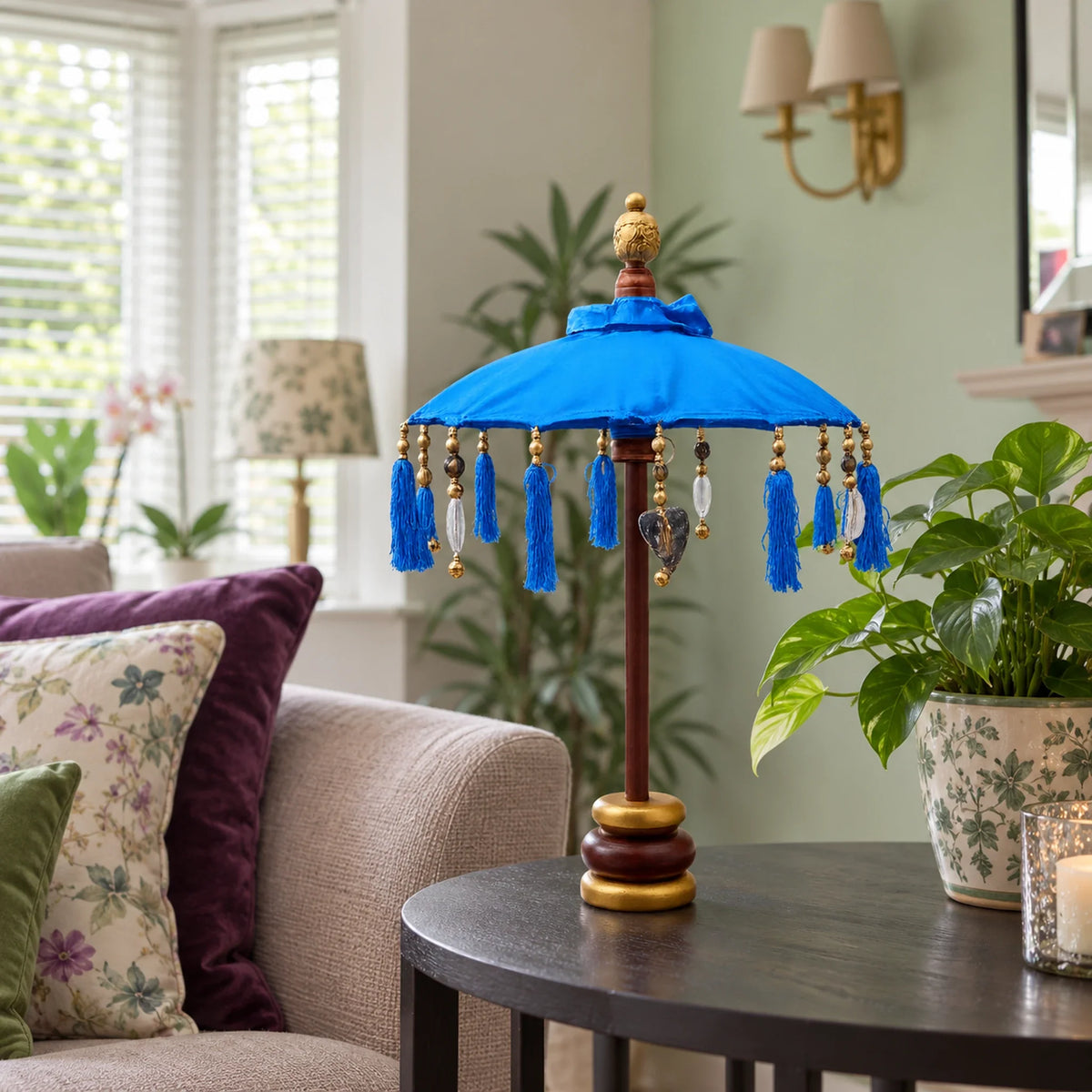 Bali Indoor Umbrella Home Decor Parasol, Cotton, Blue- 40cm on a side table in a British sitting room.
