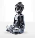 Black & Grey Buddha - Medium hand carved resin statue depicting a seated Buddha in meditation pose with detailed textured hair and flowing robes.