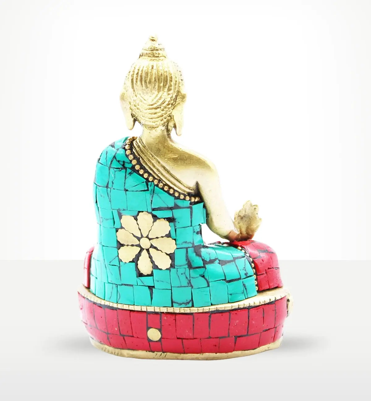 Back view of a Brass Buddha Figure - Hands Down - 11.5 cm seated on a red and turquoise decorative base with detailed mosaic inlay and gold accents.