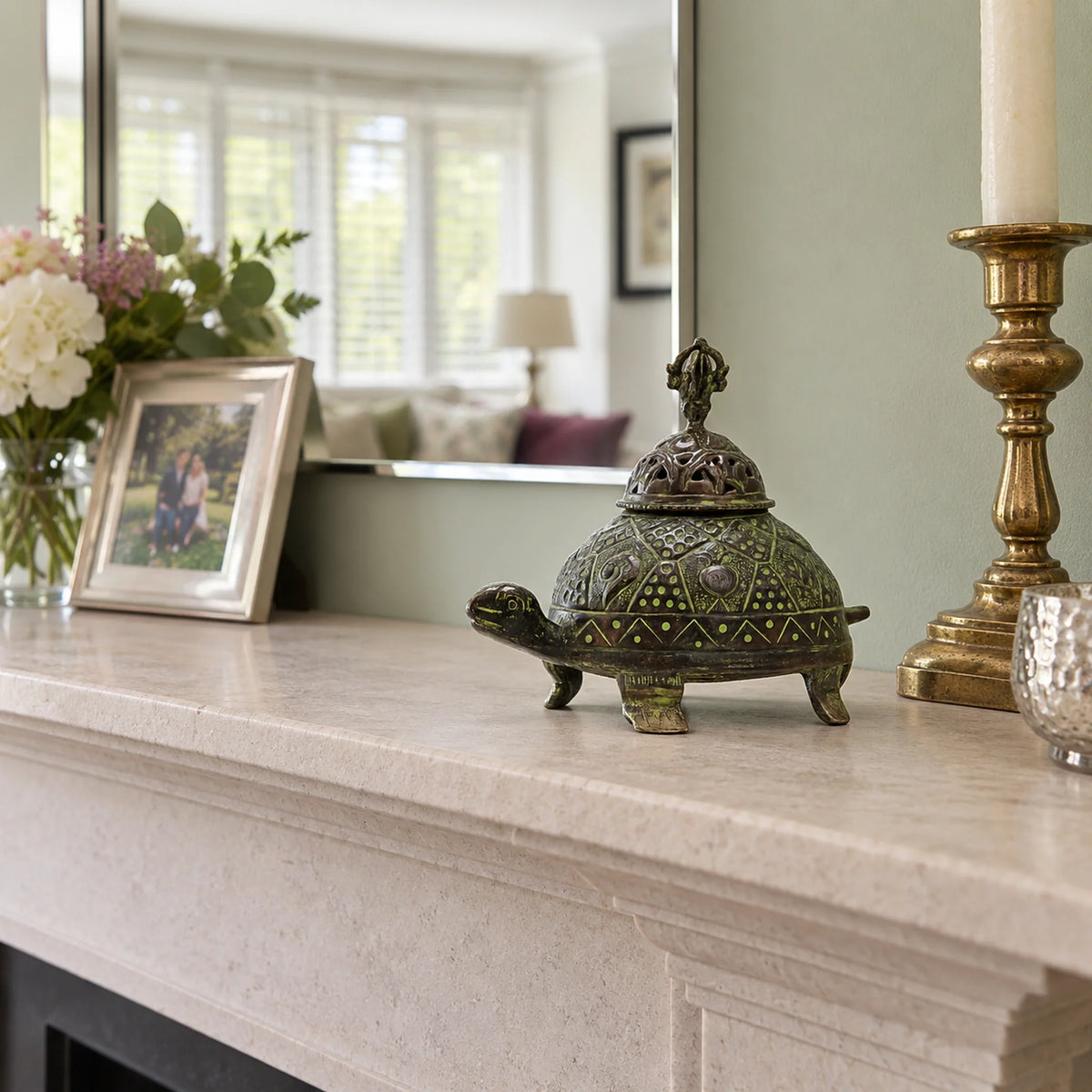Brass Verdigris Tibetan Turtle Incense Holder, Large on a mantelpiece in a British sitting room.