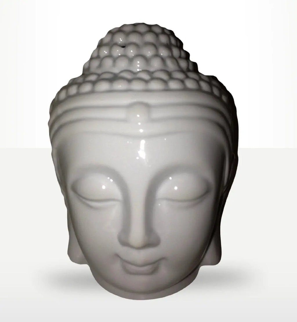 White ceramic Buddah Head Oil Burner - White with smooth, serene facial features and detailed textured hair, ideal for peaceful home decor and Buddha-themed oil burning.