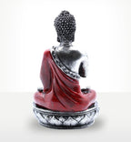 Buddha Candle Holder - Red - Medium showing the back of a silver and red Buddha figure seated on a lotus base, designed as a decorative and spiritual resin Buddha statue.