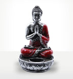 Buddha Candle Holder - Red - Medium featuring a hand-painted Buddha figure in a meditative pose, with red and silver detailing, designed to hold a candle securely.