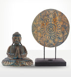 Buddha Feng Shui Set - Flower Mandala - Blue featuring a blue-accented resin Buddha statue in a meditative pose alongside a decorative flower mandala on a black stand.