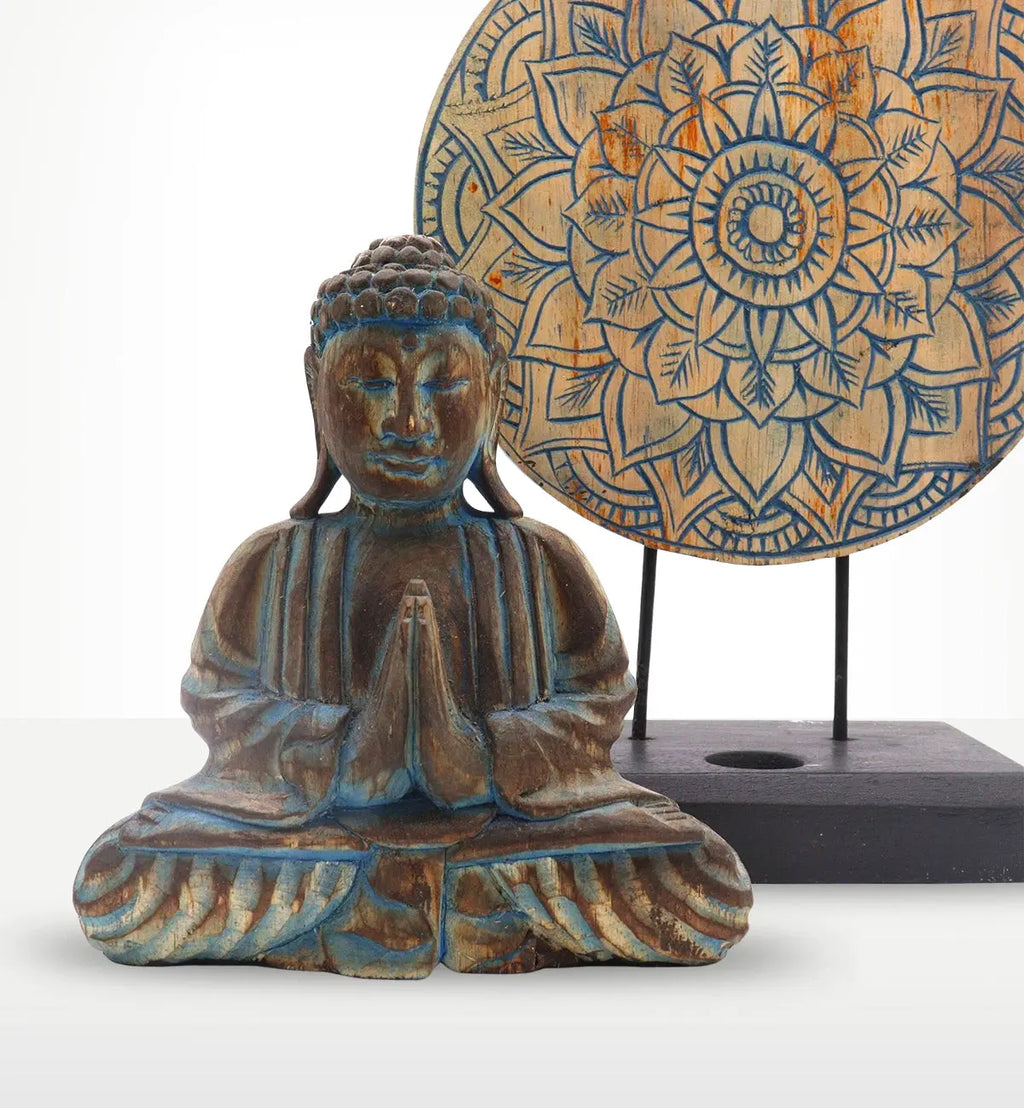 Buddha Feng Shui Set - Flower Mandala - Blue featuring a hand carved Buddha statue with hands in prayer position, made of resin with a rustic blue finish, accompanied by a detailed flower mandala wall hanging.