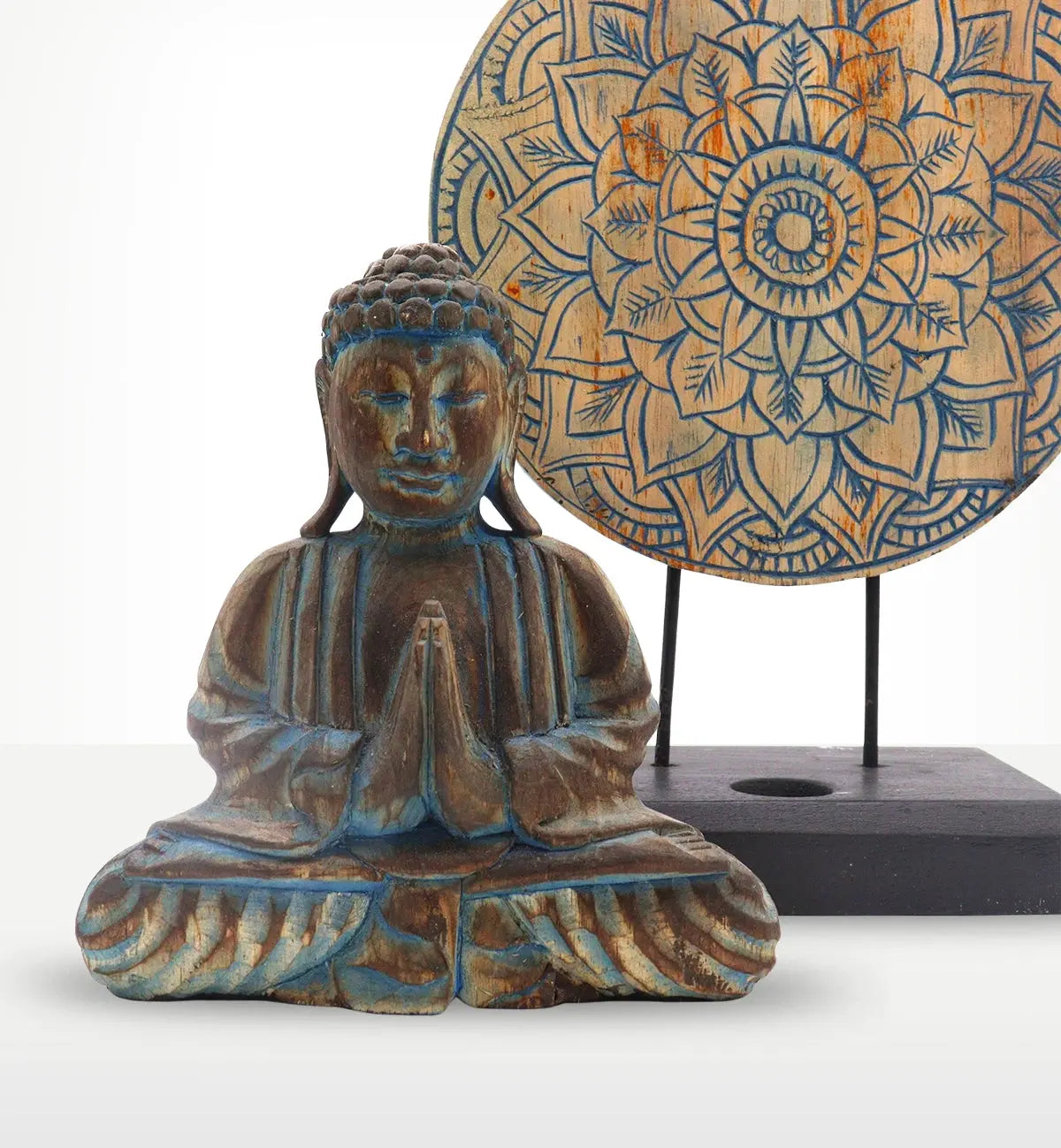 Buddha Feng Shui Set - Flower Mandala - Blue featuring a hand carved Buddha statue with hands in prayer position, made of resin with a rustic blue finish, accompanied by a detailed flower mandala wall hanging.