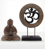 Buddha Feng Shui Set - Om - Grey & Black featuring a hand-carved Buddha statue in a seated meditation pose and a decorative Om symbol on a stand, both in grey and black tones.