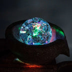 Colorful crystal-like object on a dark background