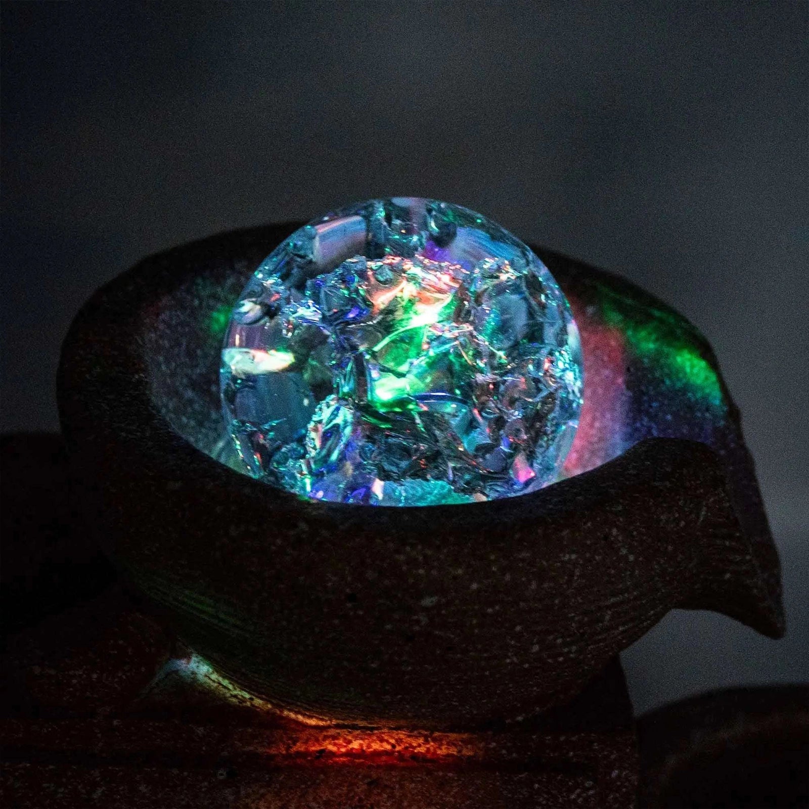 Colorful crystal-like object on a dark background