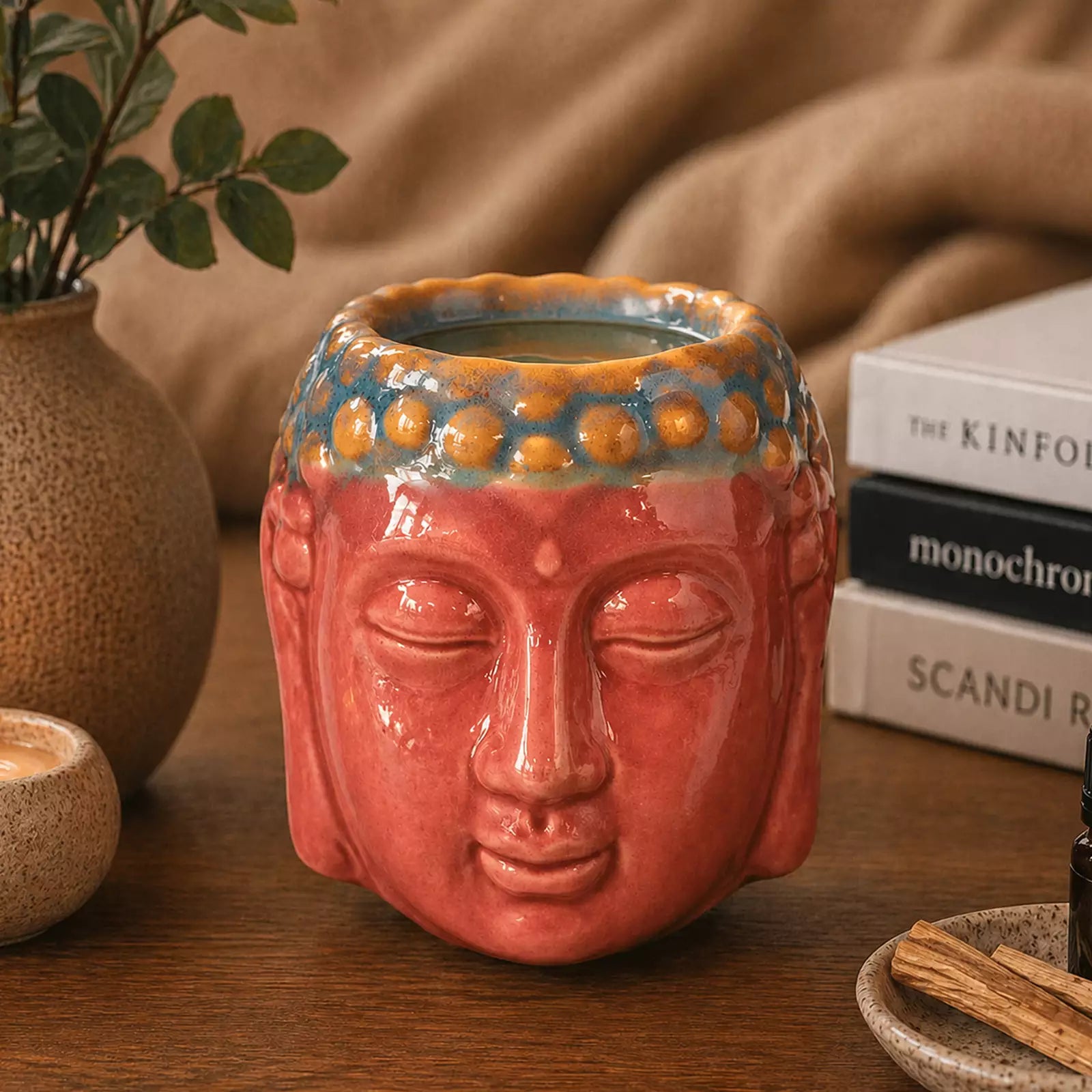 Buddha Oil Burner - Rose & Teal featuring a serene Buddha face design in rose and teal glaze, perfect for calming home decor and aromatherapy.