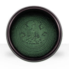Top view of Earth Powder Singing Bowl - Mandala Buddha - 16cm displaying detailed mandala design with Buddha figure in the center, featuring a green and dark contrasting color scheme.