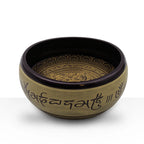 Earth Powder Singing Bowl - Mantra Five Buddha - 16cm featuring intricate engraved Tibetan mantra symbols and a decorative lotus pattern inside, showcasing detailed craftsmanship.