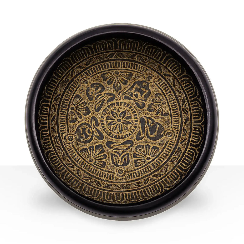 Earth Powder Singing Bowl - Mantra Five Buddha - 16cm featuring intricate golden floral and symbolic patterns etched inside a dark round bowl with a spiritual design.