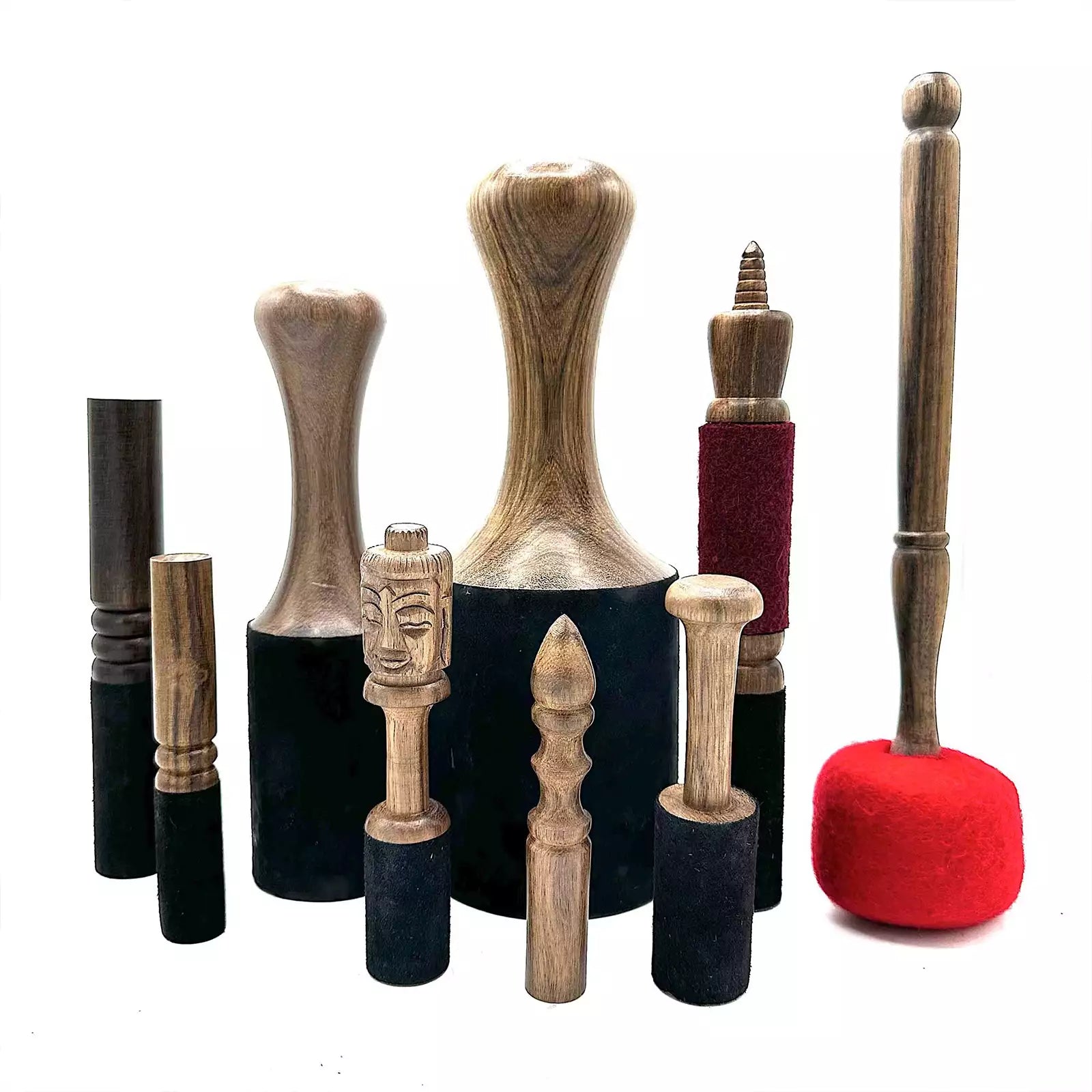 Collection of wooden and fabric-handled tools on a white background