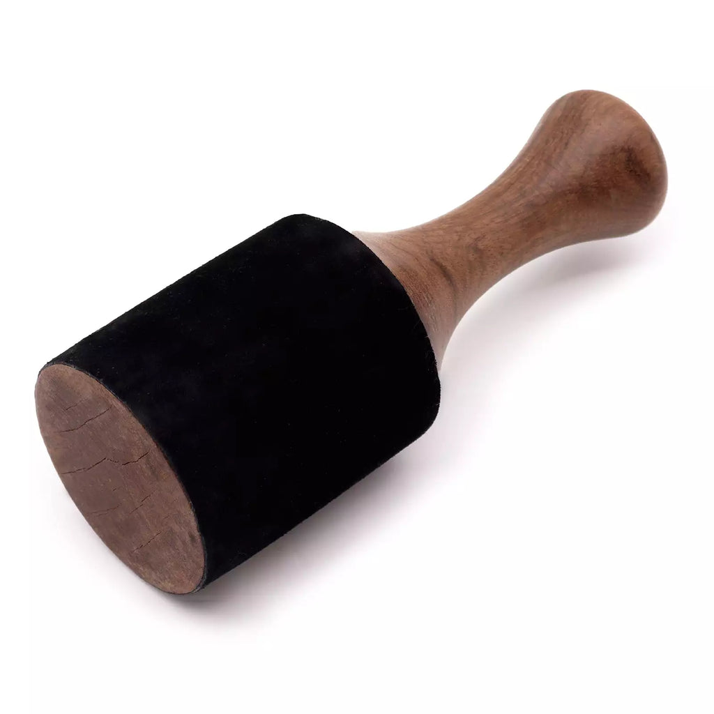 Black rubber stamp with wooden handle on a white background