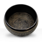 Extra Loud - Singing Bowl - Five Buddha featuring intricate hand-carved brass Buddha figures and traditional lotus and wave patterns inside a black resonant bowl for meditation and decor.
