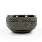 Extra Loud - Singing Bowl - One Buddha with intricate script engravings around the outer surface, crafted in a dark metal finish for meditation and decor.