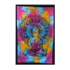 Double Cotton Bedspread + Wall Hanging - Peaceful Buddha features a vibrant tie-dye background with a detailed black Buddha figure and intricate mandala design, displayed in a cozy natural room setting.