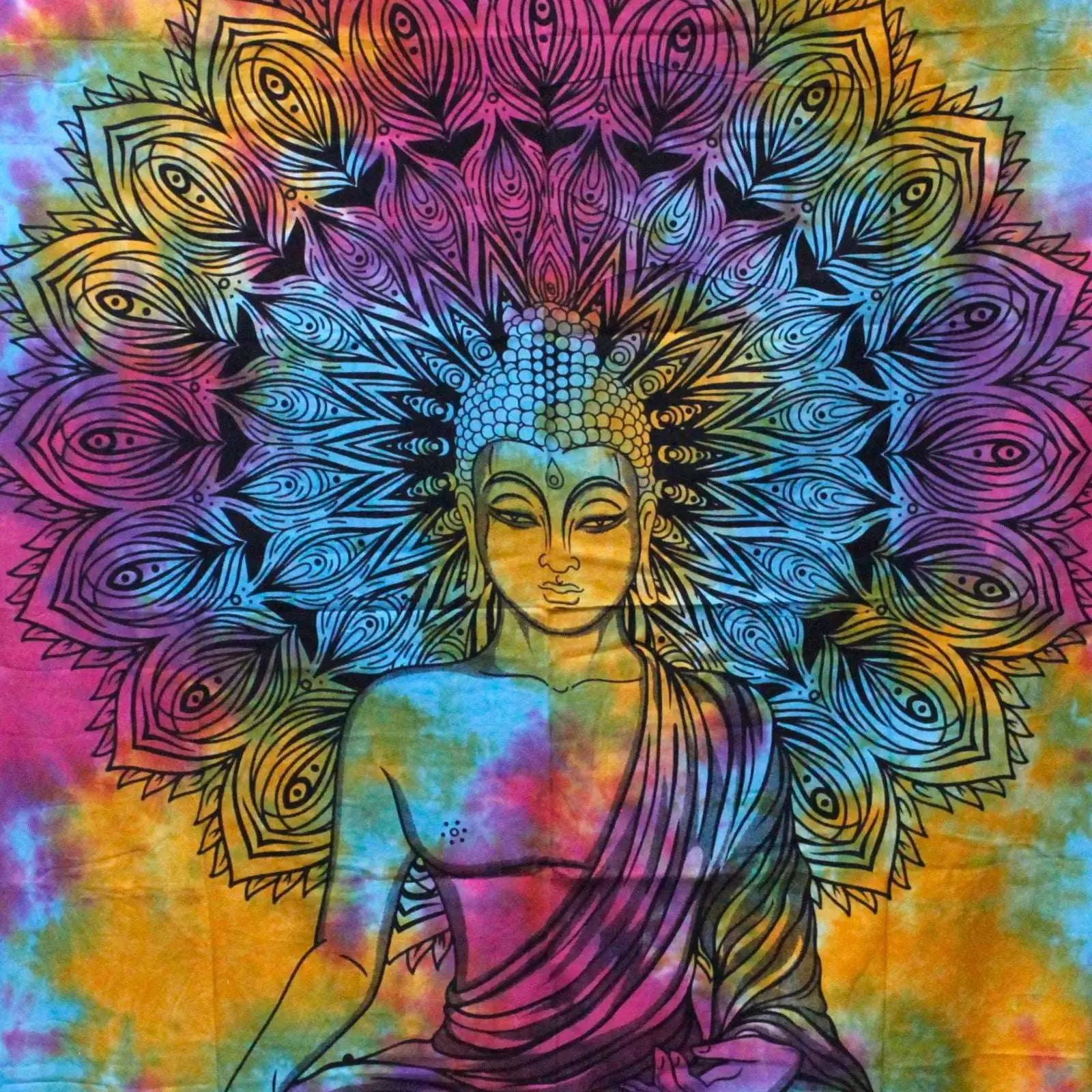 Double Cotton Bedspread + Wall Hanging - Peaceful Buddha features a vibrant tie-dye background with a detailed black Buddha figure and intricate mandala design, displayed in a cozy natural room setting.