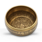 Five Buddha Singing Bowl with intricate engraved patterns inside and golden script around the outer edge, crafted from brass for spiritual and decorative use.
