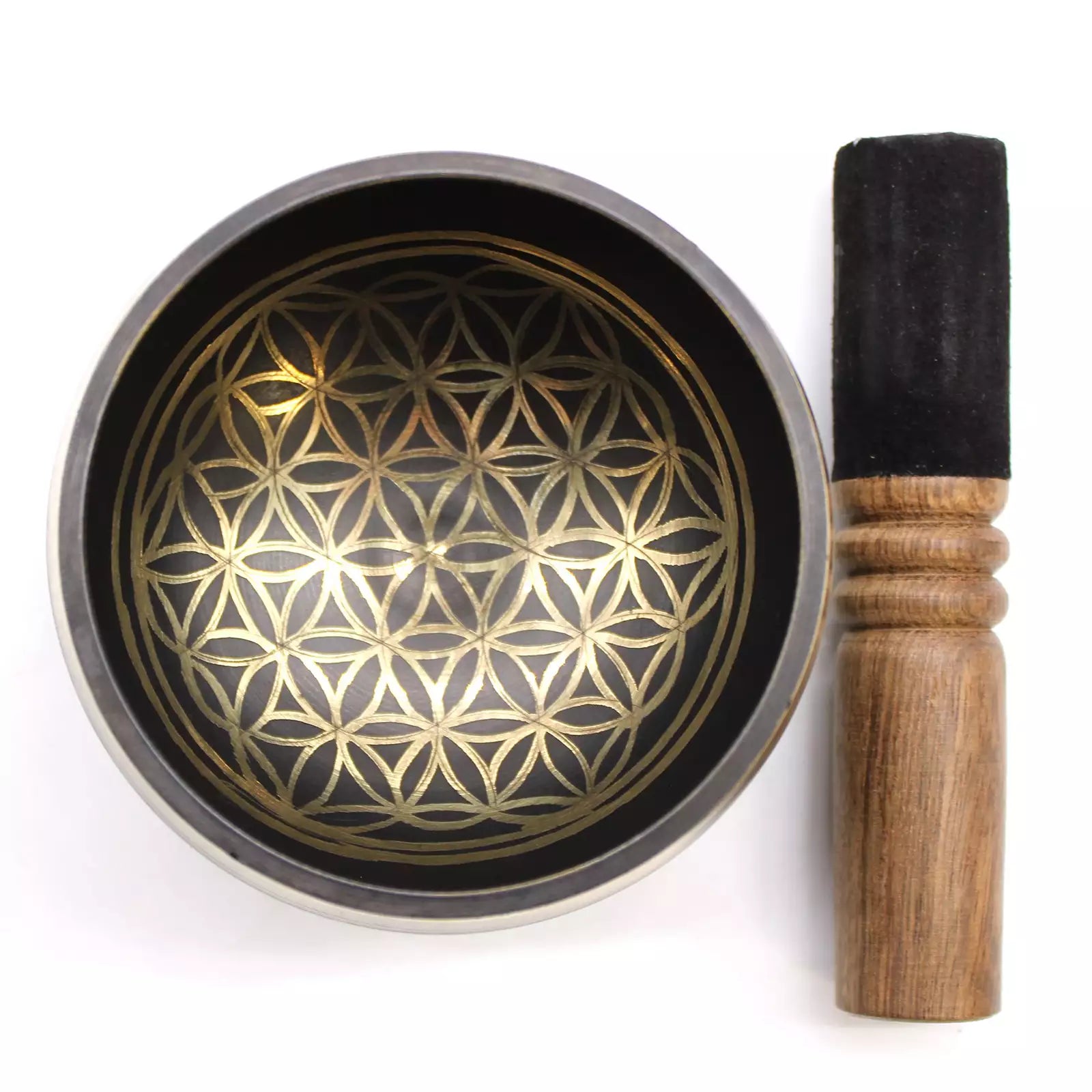 Singing bowl with gold geometric pattern and wooden striker on a white background