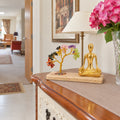 Gemstone Yoga Garden, Mudra Pose, Seven Chakra Tilted Tree with 100 Chipstones on a cabinet in a British hallway.