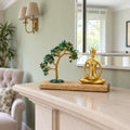 Gemstone Yoga Garden, Padmasana Pose, Green Aventurine Tilted Tree with 100 Chipstones on a mantelpiece in a British sitting room.