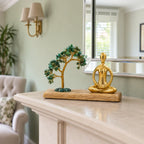 Gemstone Yoga Garden, Padmasana Pose, Green Aventurine Tilted Tree with 100 Chipstones on a mantelpiece in a British sitting room.