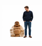 Man standing next to a large Hand Carved Wooden Happy Buddha - Whitewash 30cm statue, showcasing detailed craftsmanship and serene smiling expression in natural wood tones.