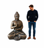 A man standing next to a Large Antique Gold Buddha Meditation in Stupa - 1.5m statue, showcasing its detailed hand-carved design and serene expression.