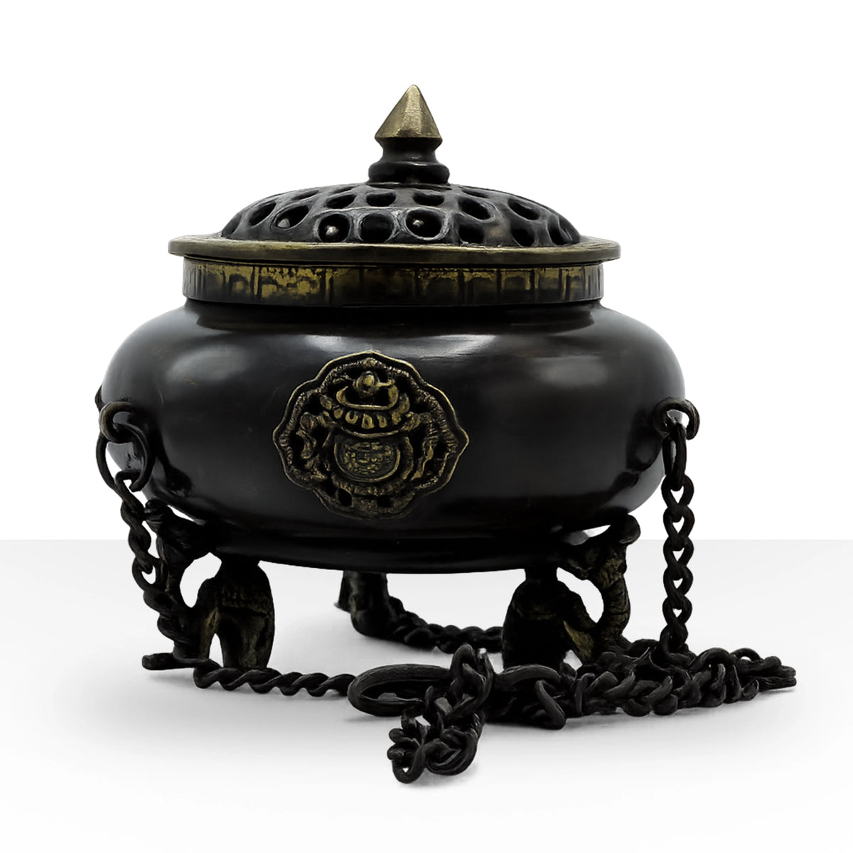 Large Brass Tibetan Burner - Four Symbol Hanging Pot with ornate brass detailing, black rounded body, decorative lid, and attached hanging chains on tripod legs.