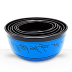 Large Chakra Set of Seven Singing Bowls (19.5-35cm) nested together, featuring vibrant blue exterior with black Sanskrit script inscriptions on each hand-crafted bowl.