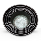 Large Chakra Set of Seven Singing Bowls (19.5-35cm) arranged nested inside each other, featuring intricate Buddha figure engraving inside the largest bowl.