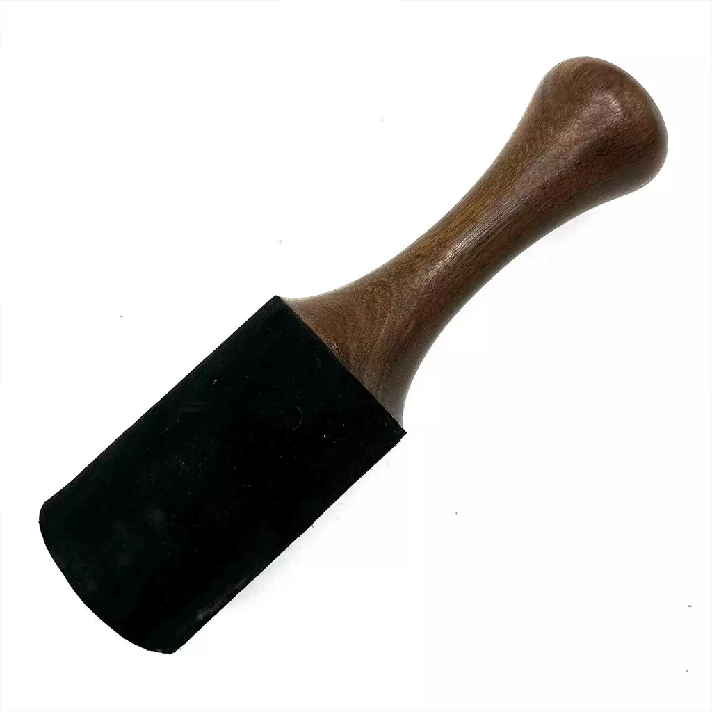 Black rubber stamp with wooden handle on a white background