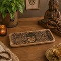 Long Tray 30x15x2.5cm - Buddha Face Black Engraved wooden tray with detailed Buddha head carving, styled on a wooden surface with serene home decor accents.