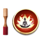 Large Buddha Singing Bowl Set- Black/Orange 14cm featuring a black Buddha figure inside a lotus design on an orange bowl with a wooden striker with red felt tip.